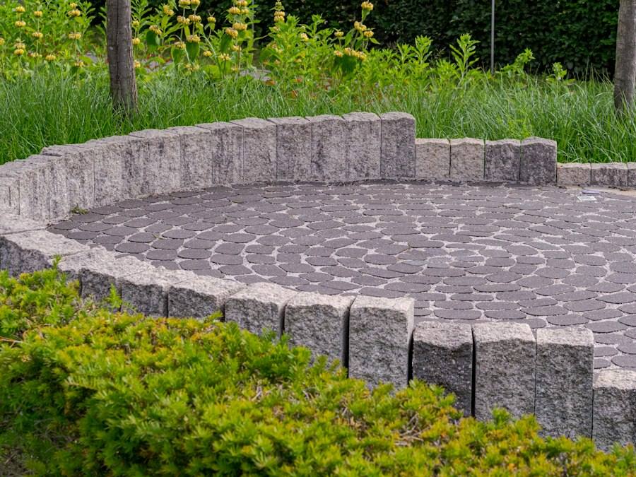 Circular paved patio with low stone wall