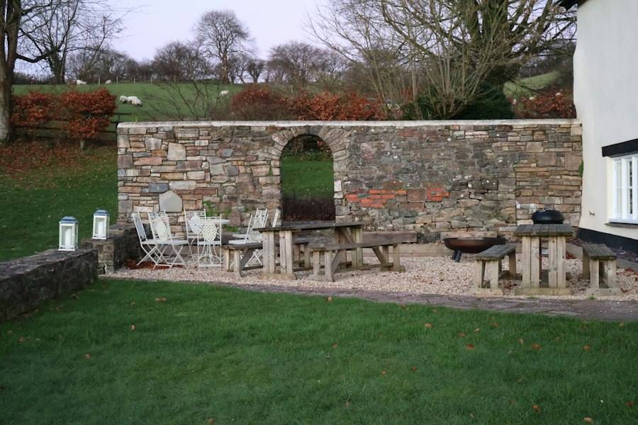 Outdoor patio with stone wall