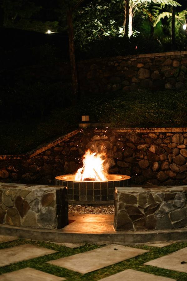 Fire pit and stone wall at night